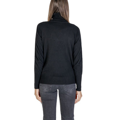Back view of Alviero Martini Prima Classe Black Viscose Turtleneck on model, showcasing high-neck design and soft knit material.