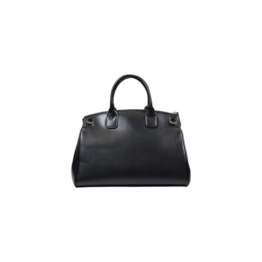 Front view with bag zipped and handles upright.