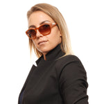 Stylish woman wearing BOLLE MOD. 12598 ROOKE 54 unisex sunglasses.