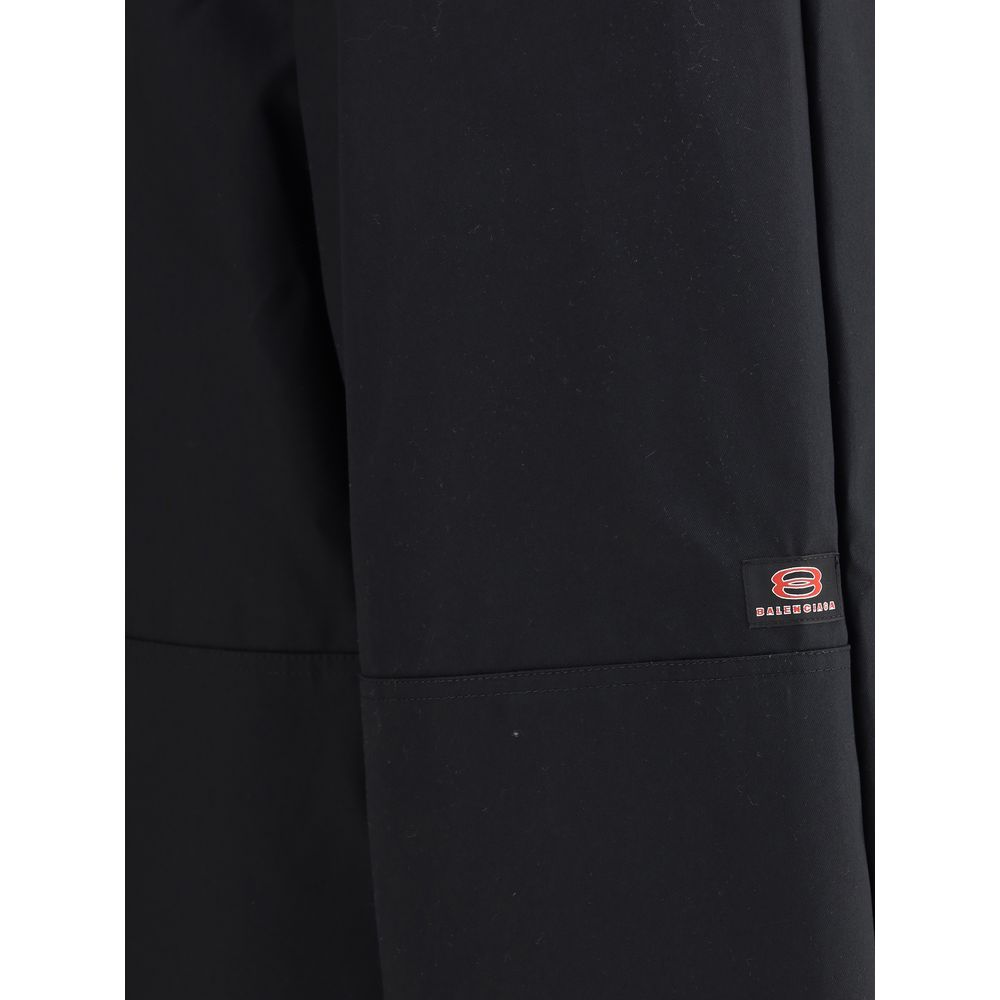 Close-up of Balenciaga Black Cotton Casual Pants showcasing logo detail and durable fabric design.