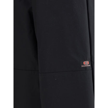 Close-up of Balenciaga Black Cotton Casual Pants showcasing logo detail and durable fabric design.