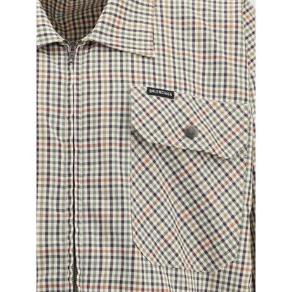 Close-up of Balenciaga Multicolor Cotton Coat featuring checked flannel, chest pocket, zipper, and Balenciaga logo embroidery.