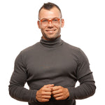 Alt Tag: Man wearing Bally Brown Unisex Glasses Frame with brown half-rim plastic frame, suitable for all genders, shown in a portrait pose.