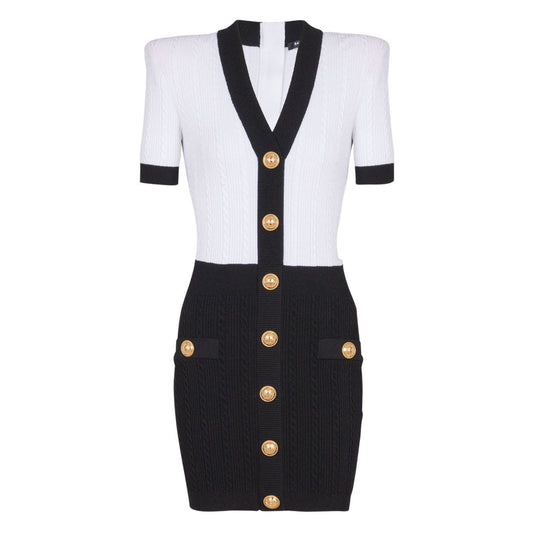 Balmain Two-tone twisted knit bodycon dress with gold buttons and short sleeves, front view.