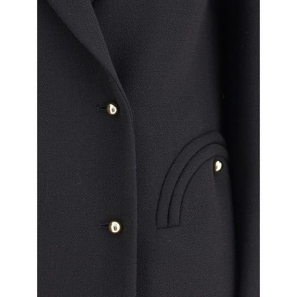 Close-up of Blazé Milano Black Fleece Wool Blazer with buttons and welt pocket detail