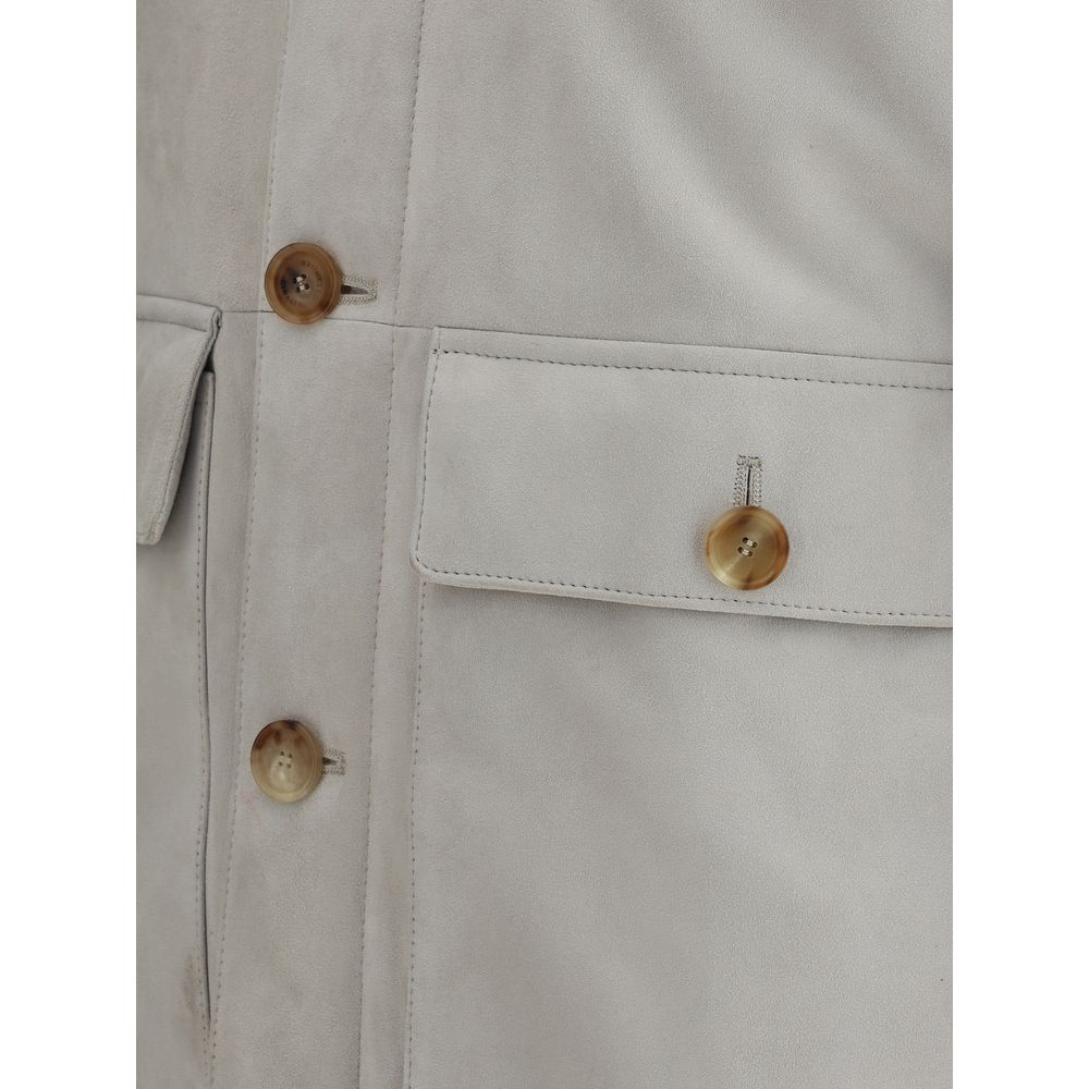 Close-up of Brunello Cucinelli Gray Leather Jacket featuring button closure and flap pockets.