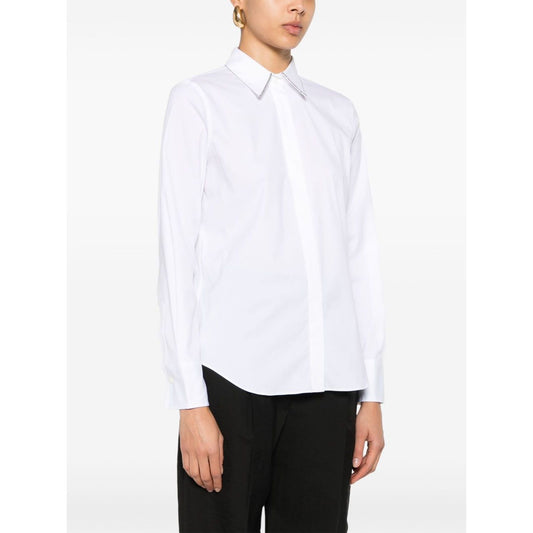 Woman wearing Brunello Cucinelli Shirts White with poplin texture and Monili chain detail.