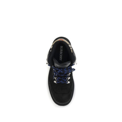 Top view of Burberry Black Calf Leather Bos Taurus Lace-Up Boots with blue-striped laces and Burberry branding on the interior.