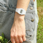 Person wearing CASIO VINTAGE Mod. F-91 BIO RESIN STRAP - WHITE wristwatch with white resin strap