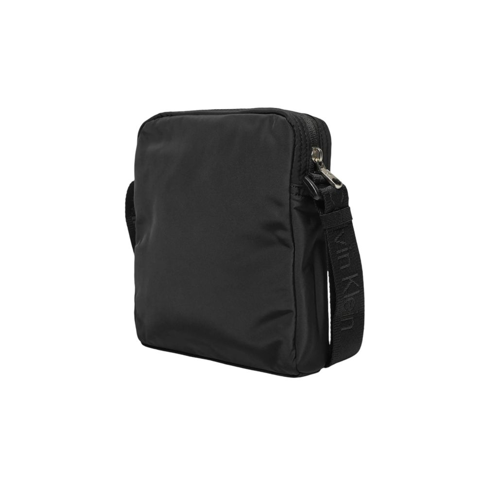 Calvin Klein Black Recycled Polyester Messenger Bag with adjustable shoulder strap, side view, showcasing sleek design and eco-friendly material.