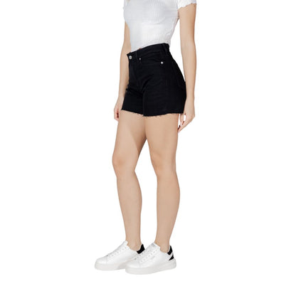 Woman wearing Calvin Klein Jeans Black Cotton Shorts with white sneakers