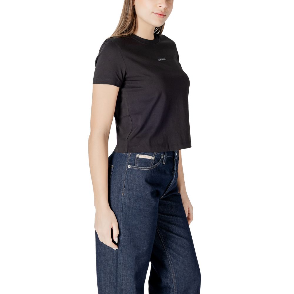 Woman wearing Calvin Klein Jeans Black Recycled Cotton Sportswear t-shirt for a casual look.