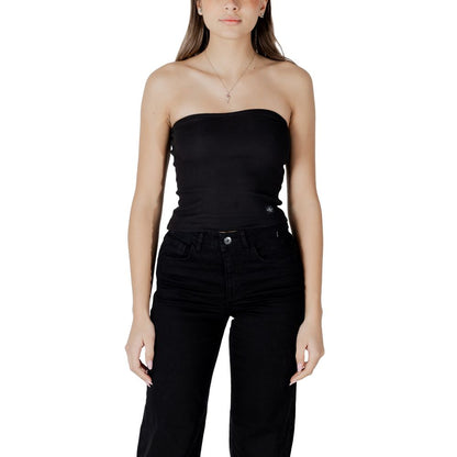 Model wearing Calvin Klein Jeans Black Recycled Cotton Top with ribbed design, made of 94% recycled cotton, for a stylish and eco-friendly look.