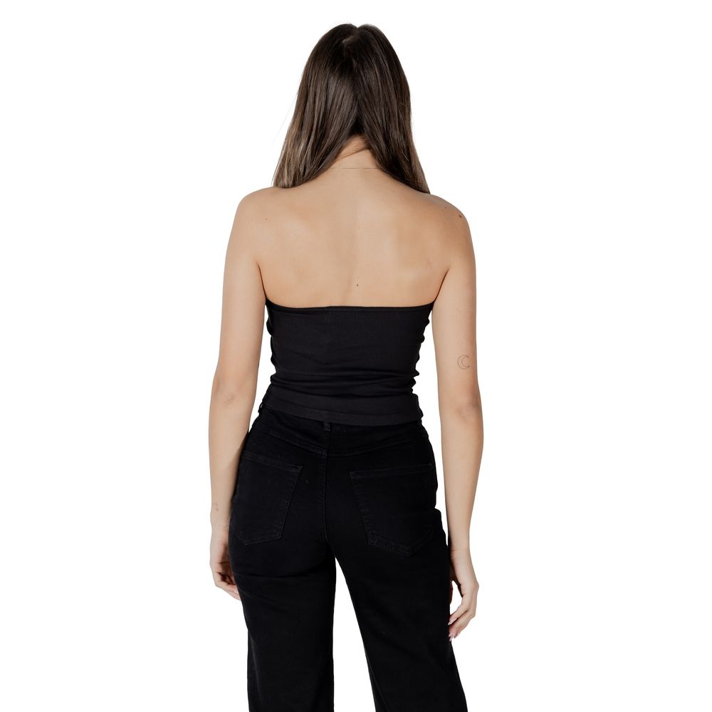 Back view of woman wearing Calvin Klein Jeans Black Recycled Cotton Top with ribbed texture and fitted silhouette.
