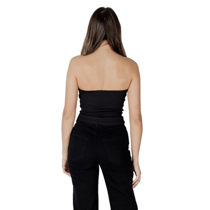 Back view of woman wearing Calvin Klein Jeans Black Recycled Cotton Top with ribbed texture and fitted silhouette.