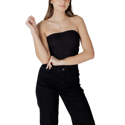 Woman wearing Calvin Klein Jeans Black Recycled Cotton Top featuring ribbed structure for elegant fitted silhouette