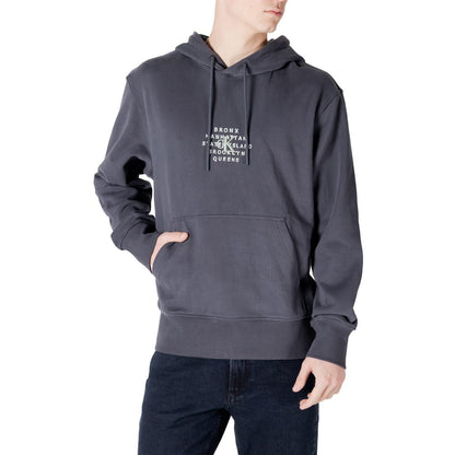 Man wearing Calvin Klein Jeans Gray Cotton Hoody with NYC graphic logo, perfect for casual wear.