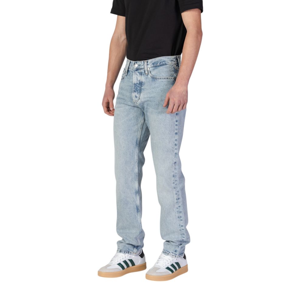 Calvin Klein Jeans Light Blue Organic Cotton Relaxed Fit Jeans worn by a model against a white background, showcasing casual style and eco-friendliness.