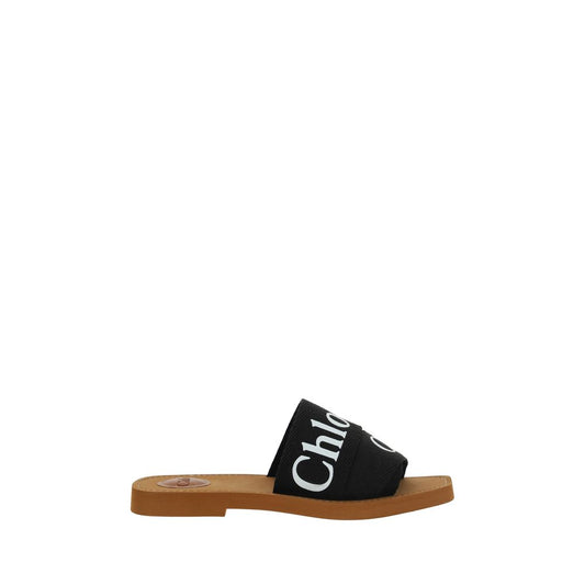 Chloé Black Rubber Sandals featuring flat sole, square toe, and iconic brand signature on double front bands, perfect for SS26.