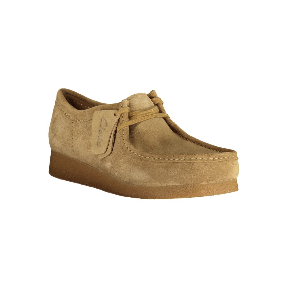 Clarks Beige Suede Men Sneaker showcasing the sleek design, lace-up style, and comfort features with a distinct logo accent.