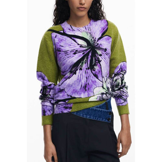 Desigual Purple Elastane Women Sweater featuring bold purple floral design with high-neck style, modeled by a woman.
