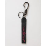 Dolce & Gabbana Black Burgundy Polyester DG Logo Men Keychain Keyring with polished metal hardware on white background.