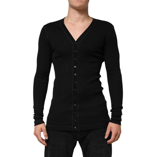 Man wearing Dolce & Gabbana Black Cotton Button Up Men Cardigan Sweater with long sleeves and V-neck design, showcasing elegance.