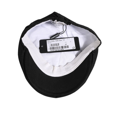 Interior view of Dolce & Gabbana Black Cotton DG Logo Newsboy Cloth Capello Hat showcasing labels and craftsmanship details.