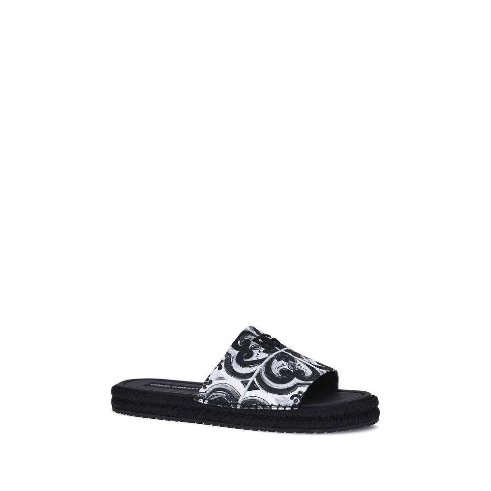 Dolce & Gabbana Black Cotton Espadrilles with shell print and flat rope sole, perfect for summer and holiday style.