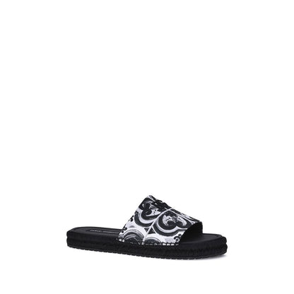 Dolce & Gabbana Black Cotton Espadrilles with shell print and flat rope sole, perfect for summer and holiday style.
