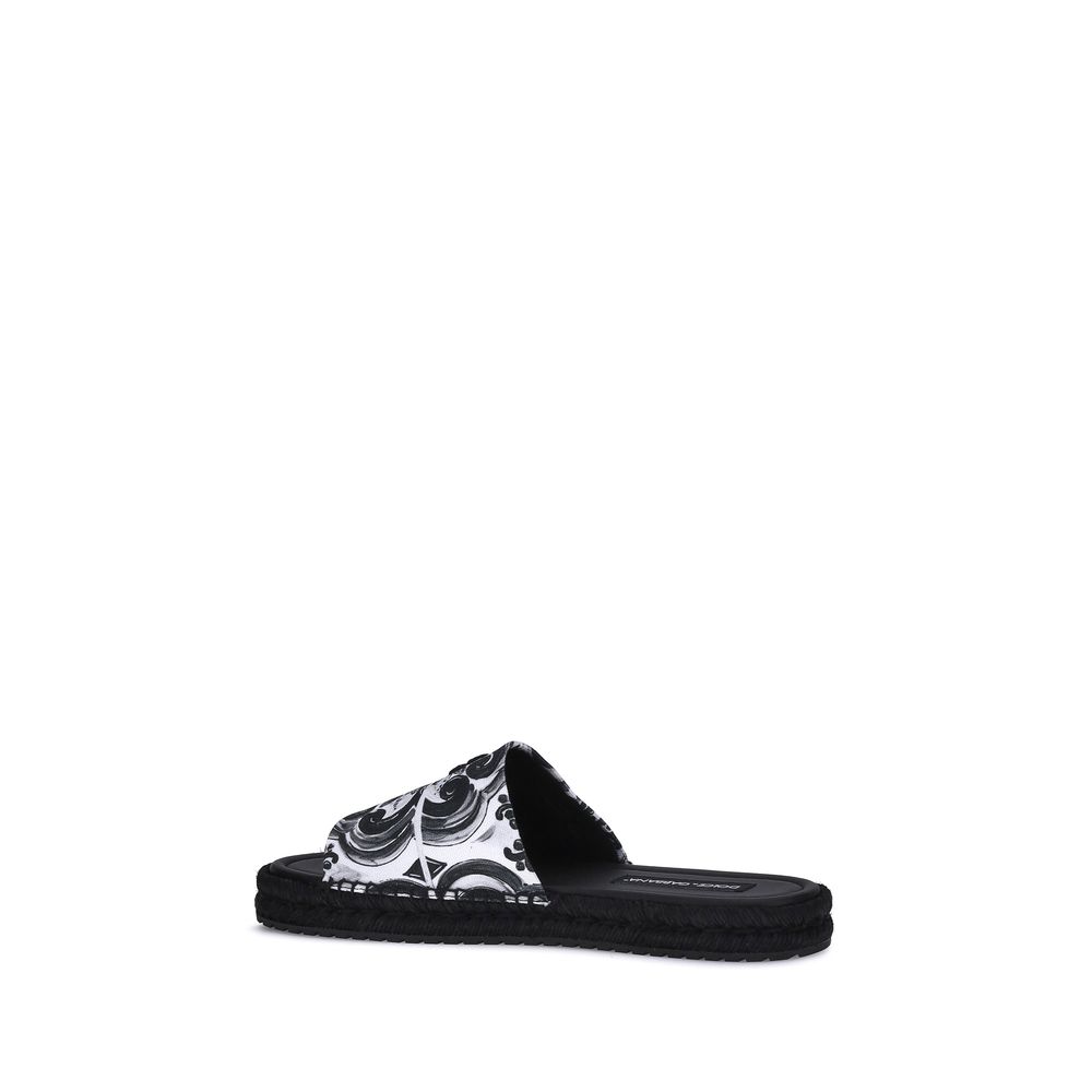 Dolce & Gabbana Black Cotton Espadrilles with shell print, round toe, flat rope sole, and lambskin insole for summer AW25 collection.