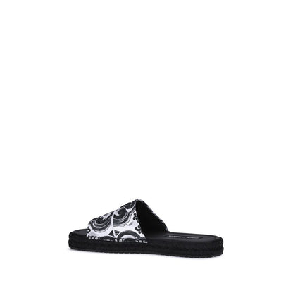 Dolce & Gabbana Black Cotton Espadrilles with shell print, round toe, flat rope sole, and lambskin insole for summer AW25 collection.