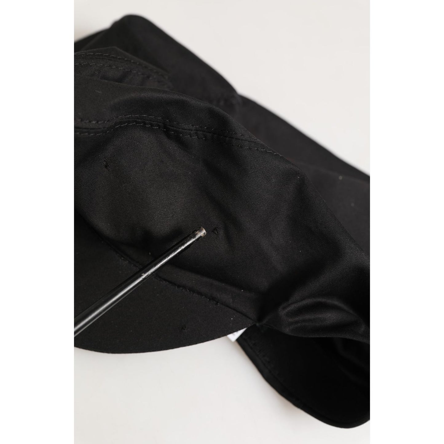 Dolce & Gabbana Black Cotton Stretch Newsboy Cloth Capello Hat with paneled crown and short brim, close-up view.