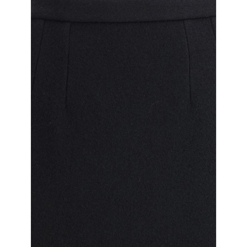 Close-up of Dolce & Gabbana Black Fleece Wool Long Skirt showcasing its elegant tailoring and fine wool texture.