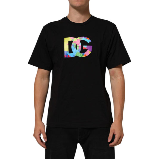 Model wearing Dolce & Gabbana Black Logo Print Cotton Crew Neck T-shirt with colorful iconic DG logo, black background.