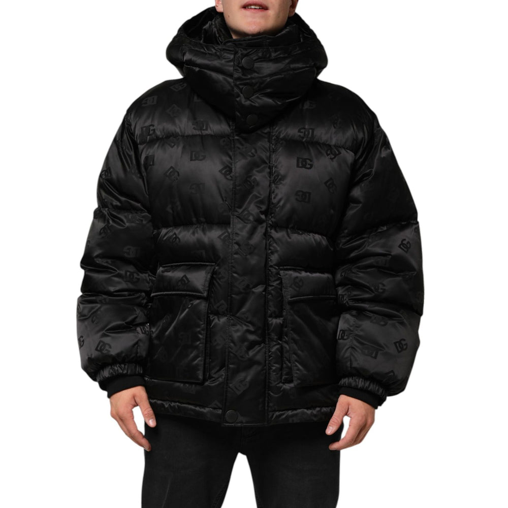 Dolce & Gabbana Black Monogram Logo Puffer Nylon Hooded Jacket with subtle DG pattern, showcasing front zip and storm flap.