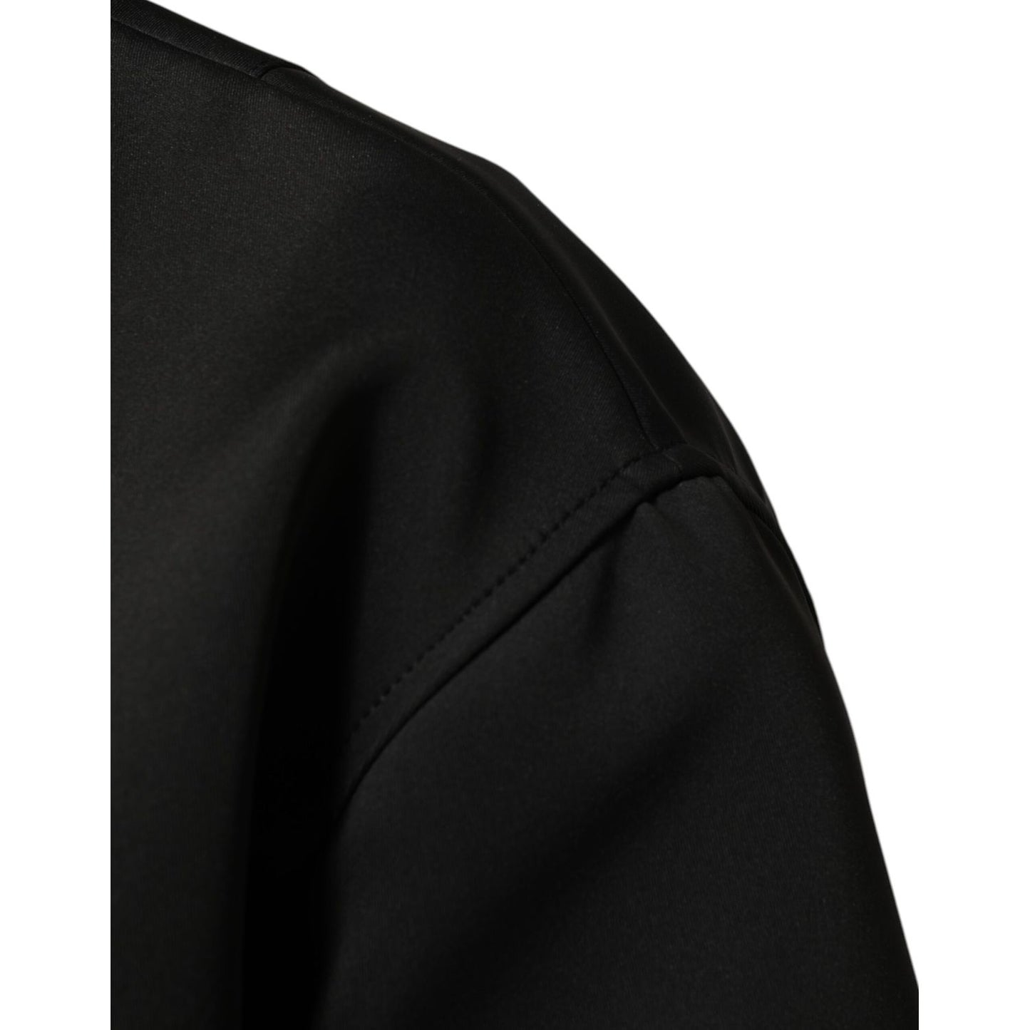 Close-up of Dolce & Gabbana Black Polyester Logo Plaque Bomber Jacket sleeve detail.
