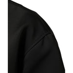 Close-up of Dolce & Gabbana Black Polyester Logo Plaque Bomber Jacket sleeve detail.