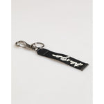 Dolce & Gabbana Black White Polyester DG Logo Silver Men Keychain Keyring with stylish black strap and silver hardware.