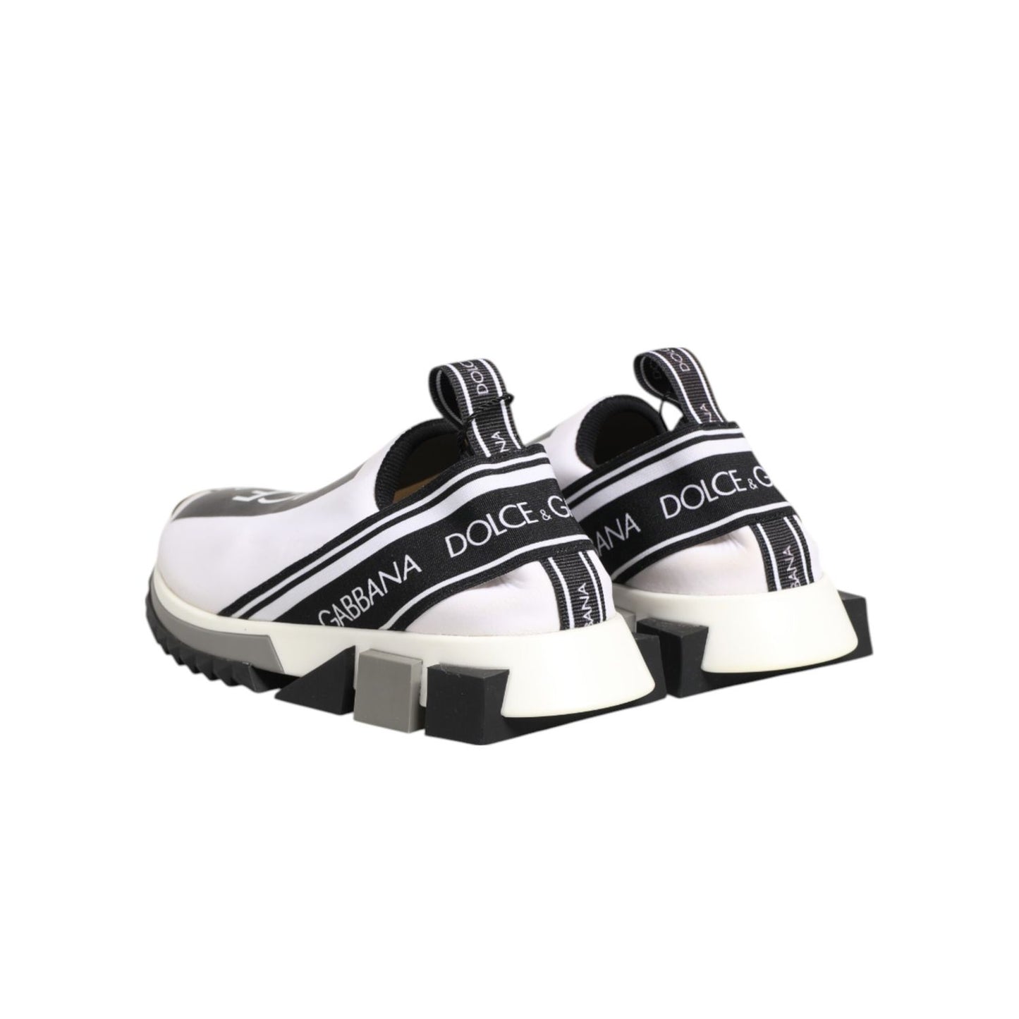 Dolce & Gabbana Black White Slip On Sorrento Sneakers Shoes with logo details and rubber sole, luxury fashion footwear side view.