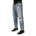 Dolce & Gabbana Blue Distressed Ripped Denim Trouser Jeans with modern streetwear style and brand logo plaque.