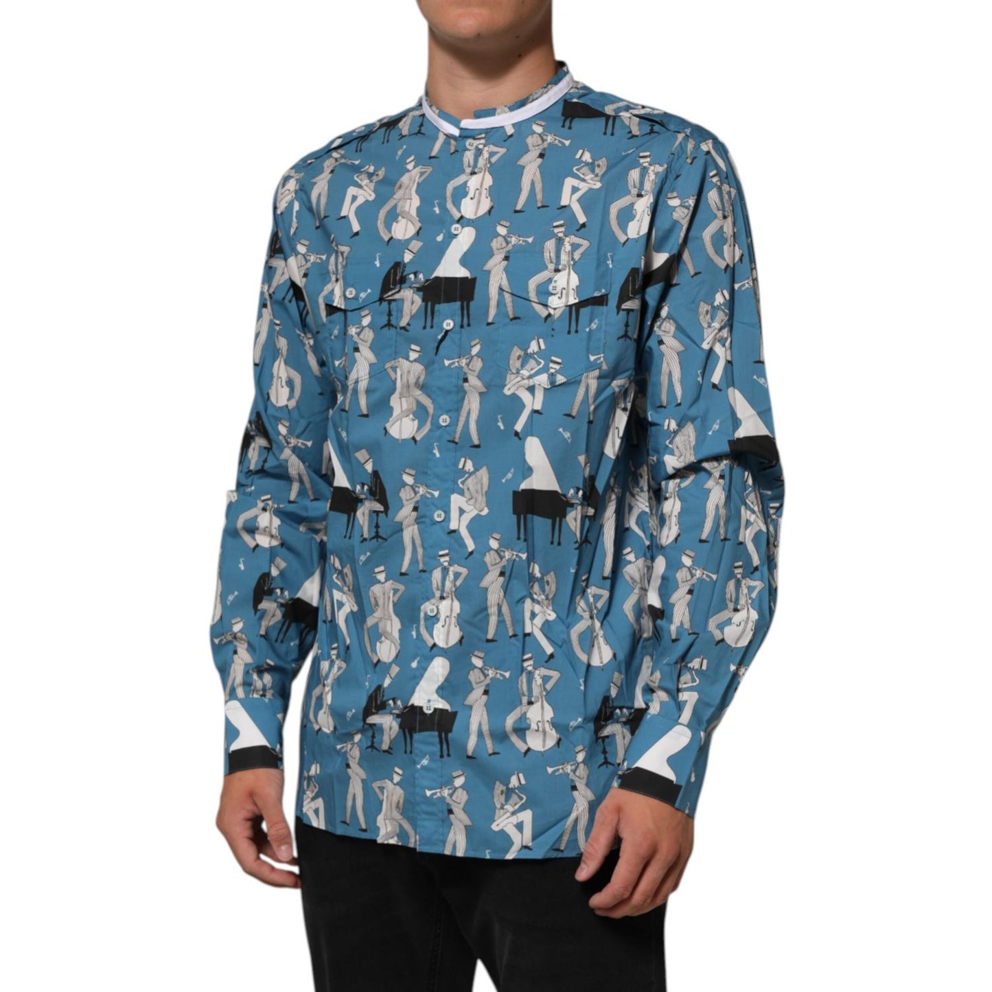 Man wearing Dolce & Gabbana Blue Jazz Printed Cotton Button Front Shirt with long sleeves, featuring jazz-inspired print.