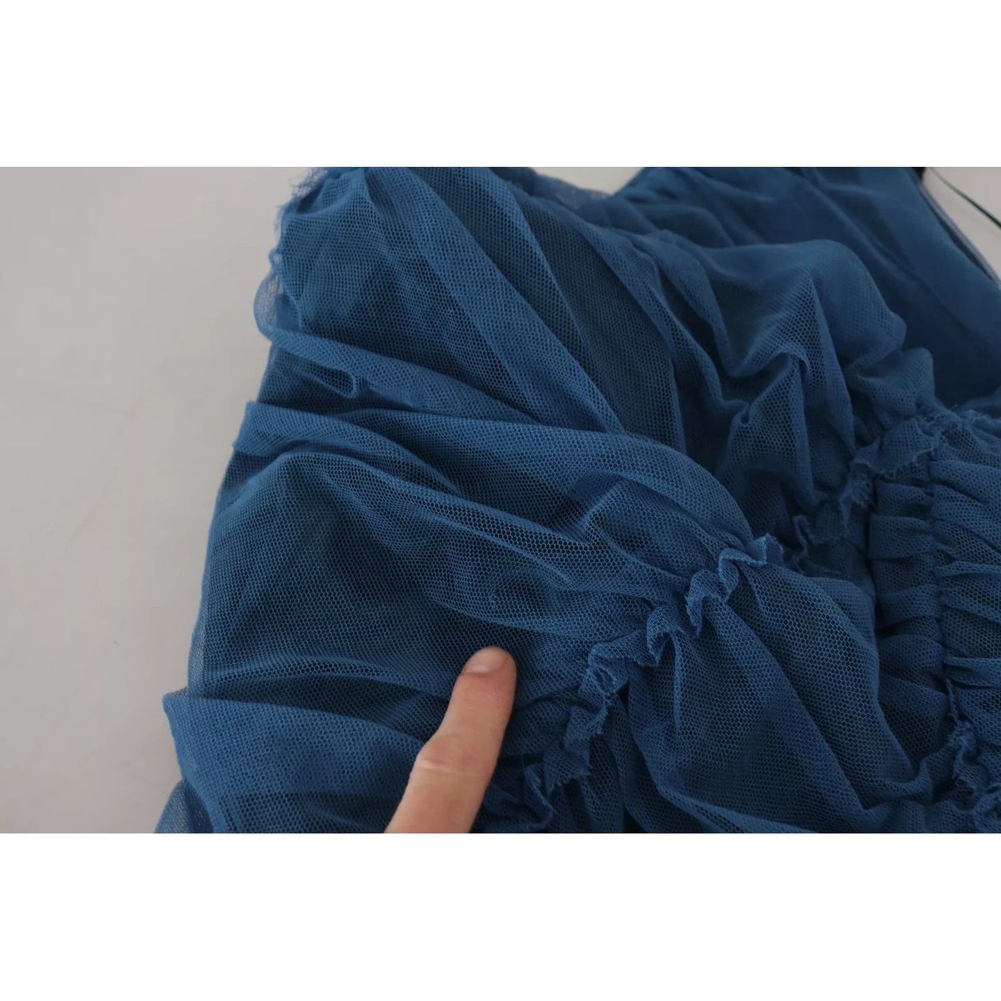 Close-up of Dolce & Gabbana Blue Mesh Trim Ruched Tulle Sheath Dress fabric showing texture and details.