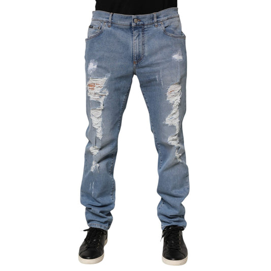 Dolce & Gabbana Blue Tattered Slim Fit Cotton Denim Jeans with distressed detailing and sleek silhouette.