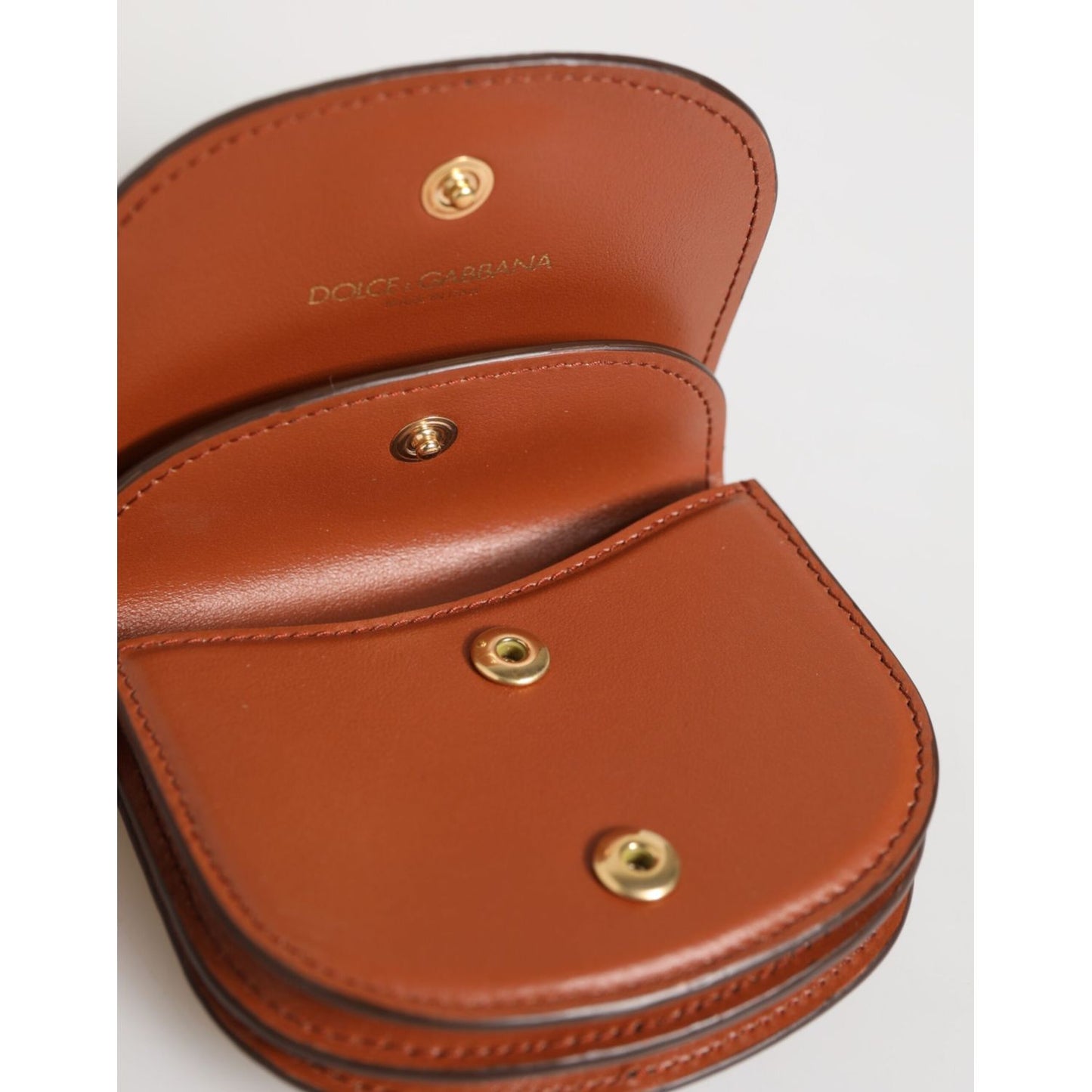 Dolce & Gabbana Brown Black Calf Leather Leopard Print Logo Plaque Wallet showing snap button closure and interior compartments.