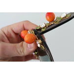 Close-up of Dolce & Gabbana DG4283B Acetate Crystals Orange Appliques Sunglasses with visible glue marks.