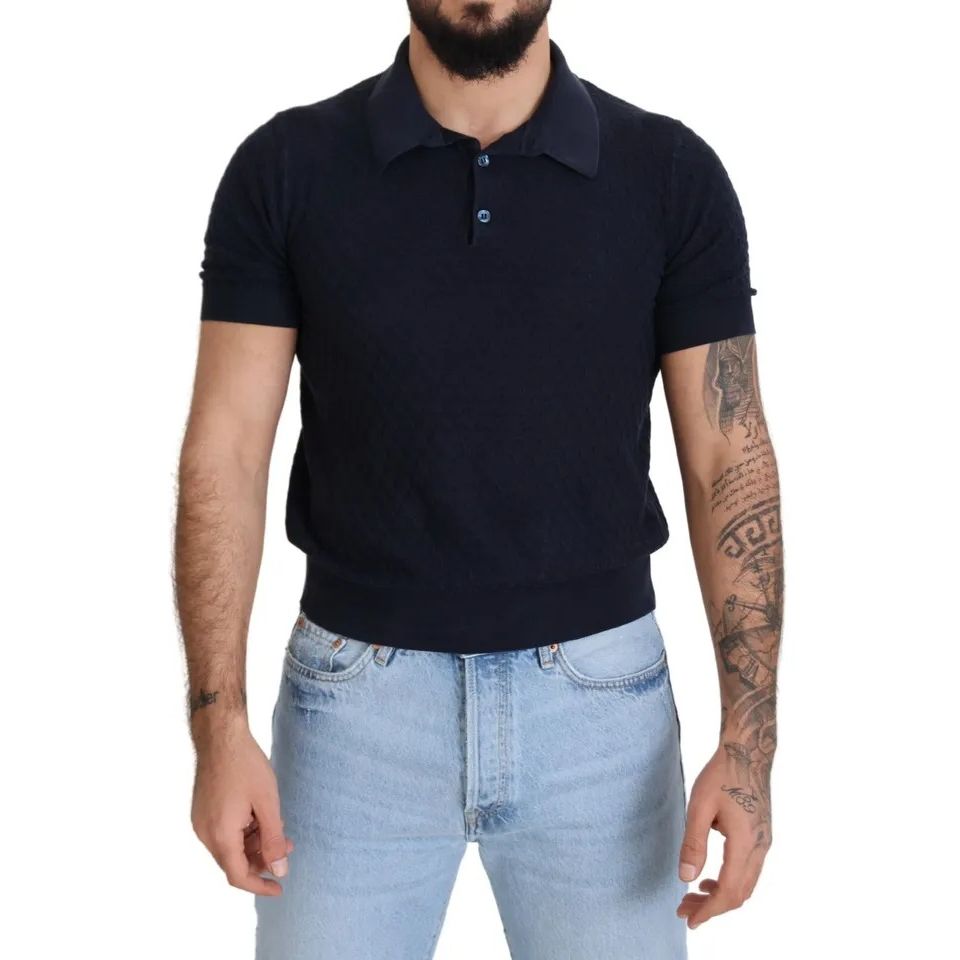 Man wearing Dolce & Gabbana Dark Blue Collared Polo Casual Silk T-shirt paired with jeans, showcasing short sleeves and regular fit.
