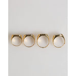 Dolce & Gabbana Gold Tone Brass JAZZ Letter Set 4 Pieces Adjustable Ring showcasing the band's luxurious aesthetic.