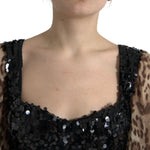 Close-up of Dolce & Gabbana Leopard Print Silk Sequin Ruffle Maxi Dress showcasing the sequined bodice and leopard print sleeves.