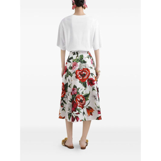 Rear view of a person wearing a white short-sleeve Dolce & Gabbana Logo cotton t-shirt and a floral print skirt, standing on a white background.